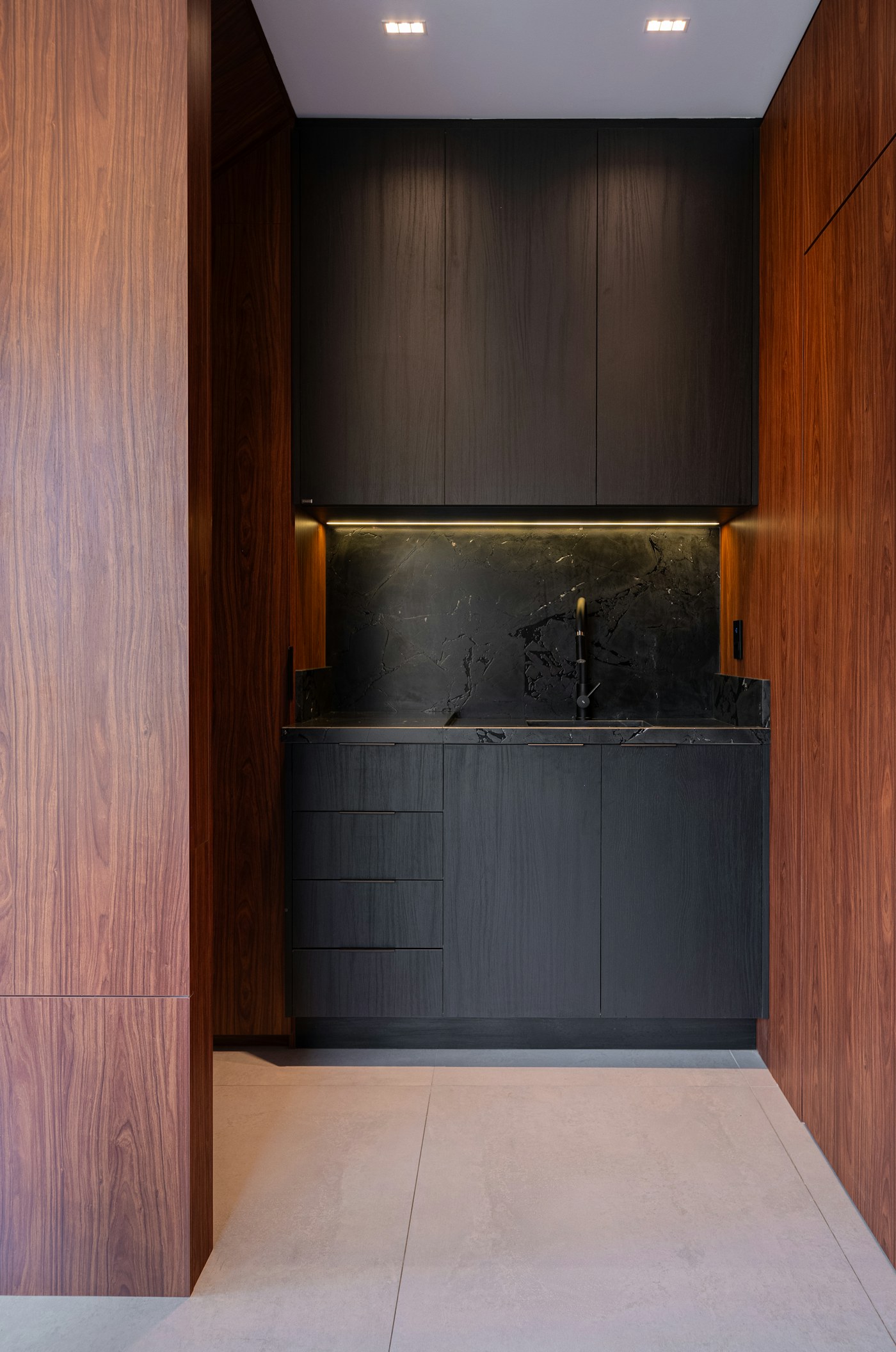 Bespoke walnut kitchen with black marble worktop by Zayan Design, Marrakech
