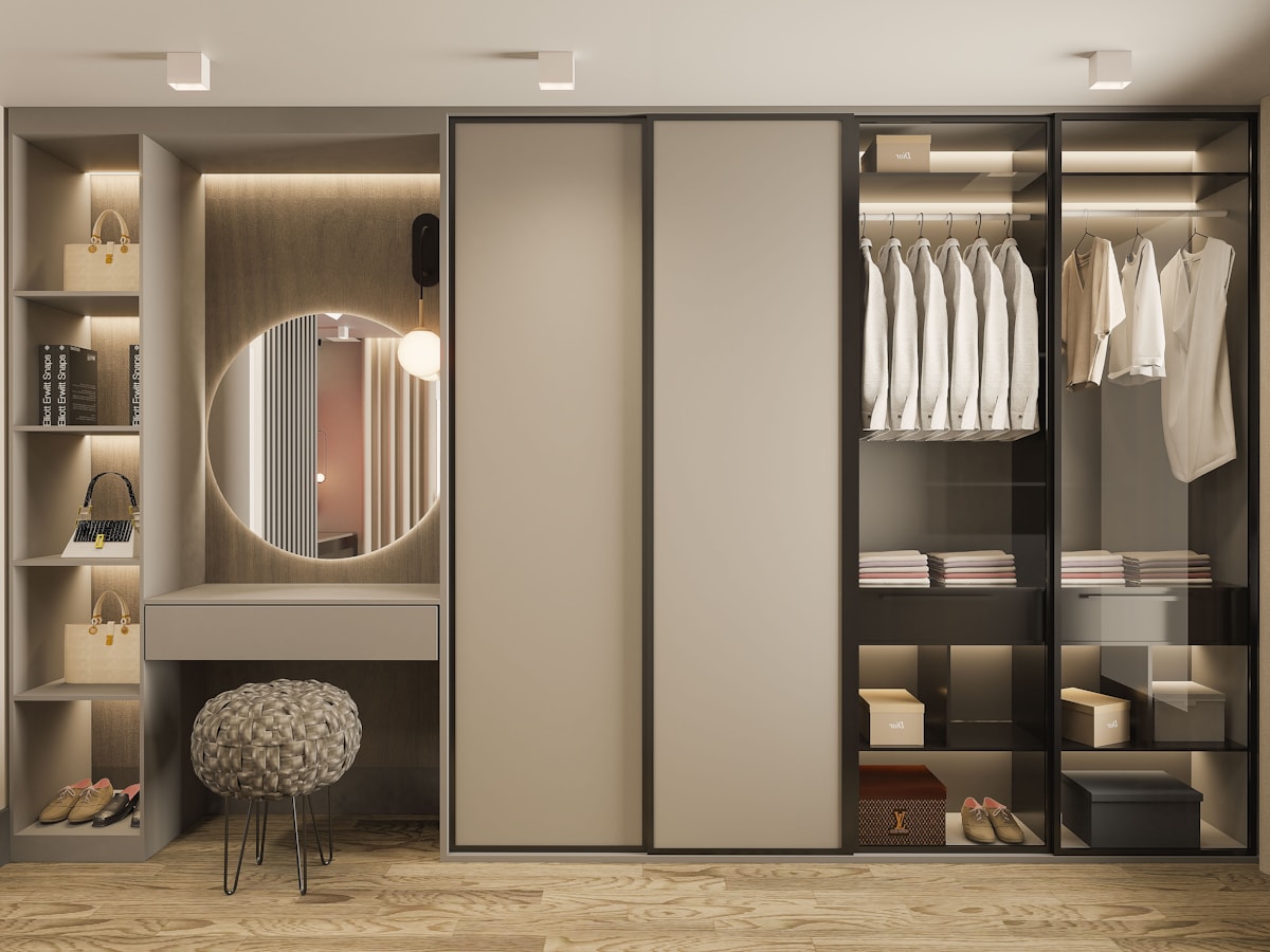 Bespoke wardrobe with dressing table and backlit round mirror